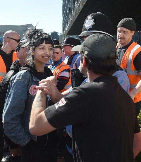 This Woman Resisted EDL Men With A Smile! Her Pic Has Gone Viral & She’s Become Hero On Twitter