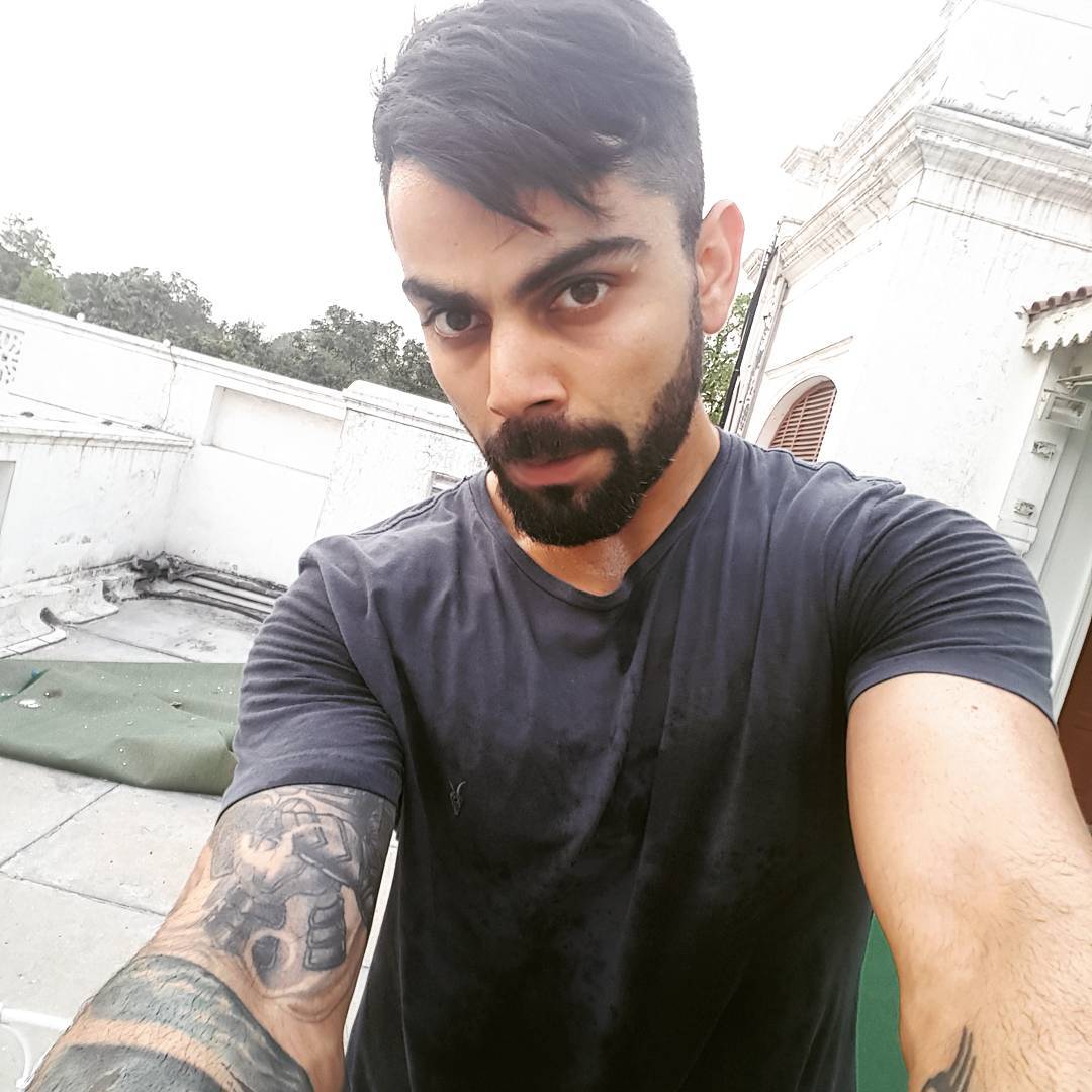 15 tattoos of virat kohli tattoosशररवर १५ टट वरट झल आशचरयचकत   odishas pintu behra has his body covered with 15 tattoos of virat kohli  tattoos gets rewarded with a hug from