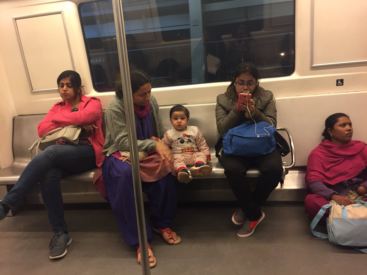 Mother & Child Take Seats While Nanny Is Sitting On Floor Inspite Of Delhi Metro Being Empty RVCJ Media