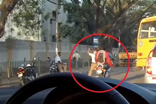 Traffic Cop Throwing Shoe At Two Bikers Without Helmet Caught On Camera, Suspended - RVCJ Media