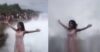 Girl Stands On A Cliff And Poses With Her Arms Wide Open. A Huge Wave Comes And Takes Her Away RVCJ Media