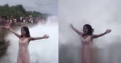 Girl Stands On A Cliff And Poses With Her Arms Wide Open. A Huge Wave Comes And Takes Her Away RVCJ Media