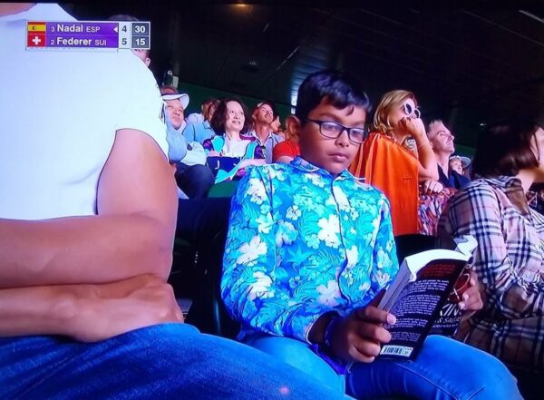 Indian Boy Found Reading A Book During Federer-Nadal Match. Twitter Can’t Stop Talking About Him - RVCJ Media