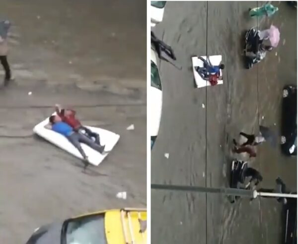 “Aag Lage Basti Me, Launde Apni Masti Me,” Twitter On 2 Guys Floating In A Mattress On Flooded Road - RVCJ Media