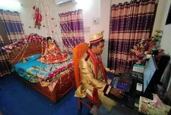 Viral Photo Of Dulha Being Busy On Computer On Suhaagraat & Bride Waiting Sparks Meme Fest RVCJ Media