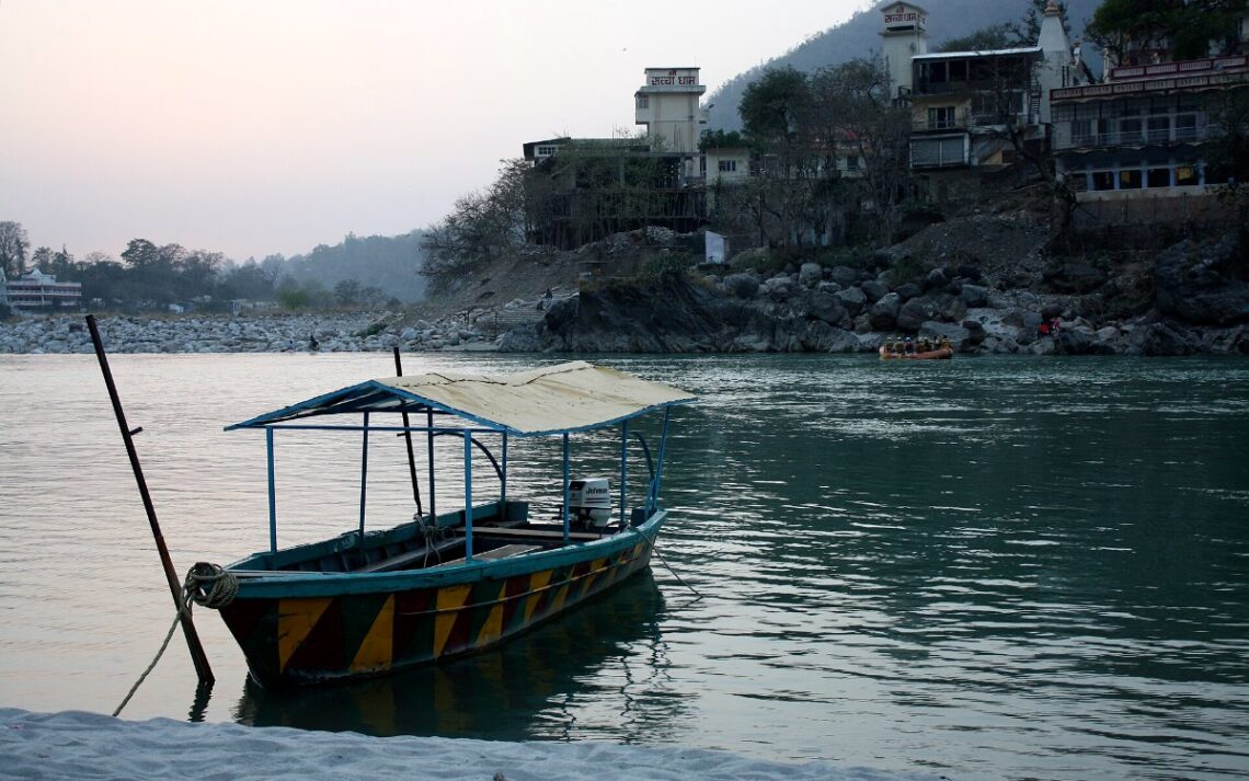 7 Weekend Getaways From Delhi To Escape The Smog This November 1 Weekend getaways from Delhi: boat on the Ganga near Lakshman Jhula, Rishikesh